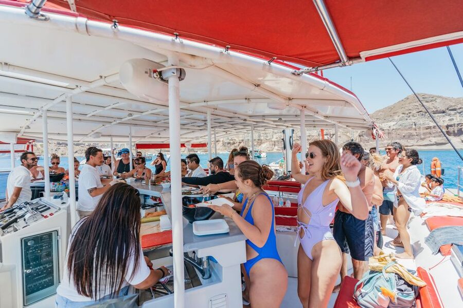 Santorini: Catamaran Tour with BBQ Dinner, Drinks, and Music - Music, dancing, and the right kind of boat party