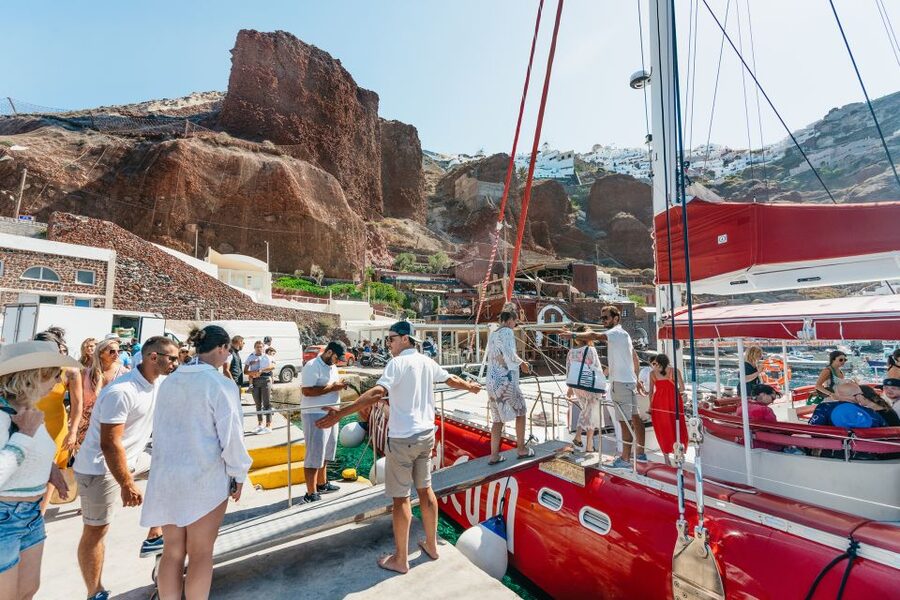 Santorini: Catamaran Tour with BBQ Dinner, Drinks, and Music - The caldera return and sunset choice