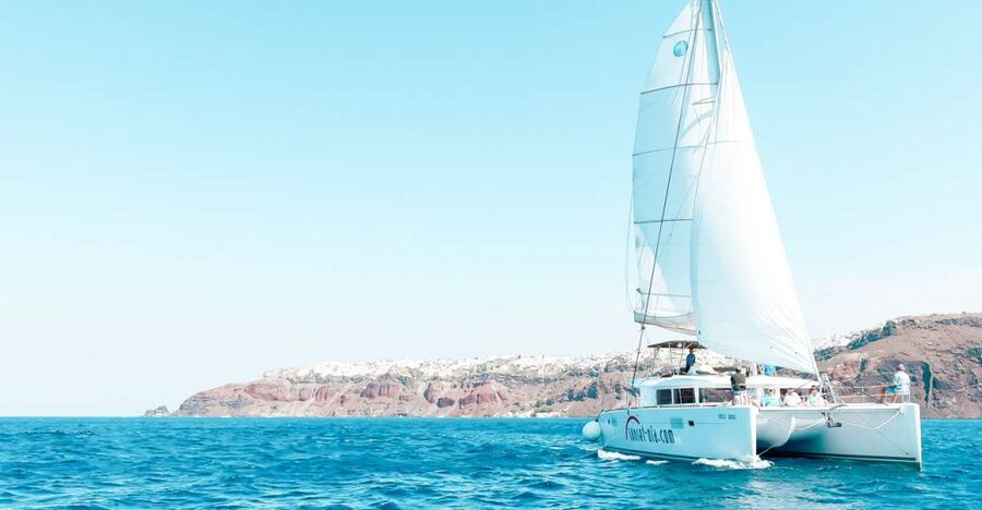 Santorini: Catamaran Tour with BBQ Meal and Unlimited Drinks - Why seeing Santorini from the sea changes the island