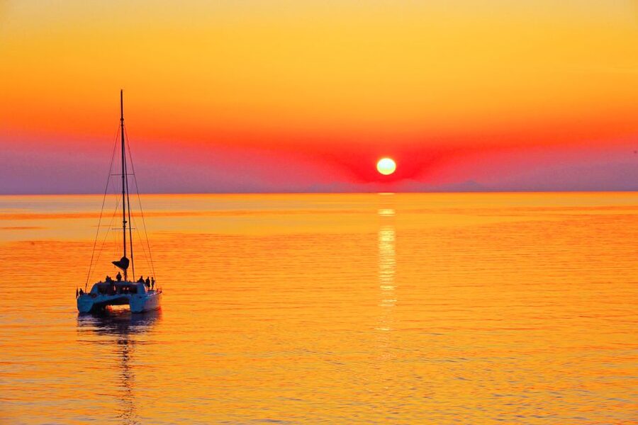 Santorini: Catamaran Tour with BBQ Meal and Unlimited Drinks - White Beach, swimming, and lunch on deck