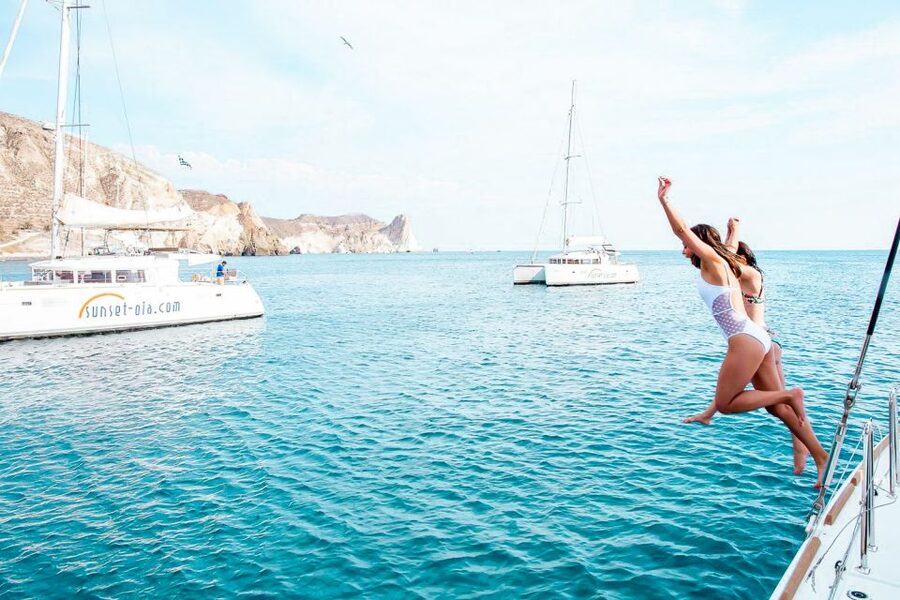 Santorini: Catamaran Tour with BBQ Meal and Unlimited Drinks - Red Beach and the snorkeling stop