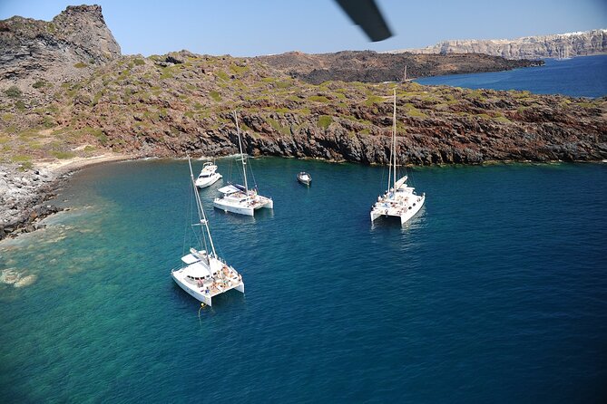 Santorini Classic Catamaran Cruise with BBQ, Drinks and Transfers - The volcano and the caldera from the water