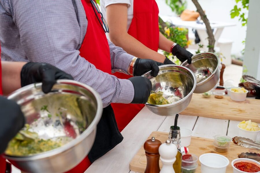 Santorini: Cooking Class with Lunch and Wine Tasting - Cooking Greek food beside Kamari’s volcanic beach