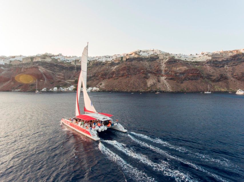 Santorini: Cruise Catamaran with BBQ & Drinks Day or Sunset - Red Beach for swimming and snorkeling