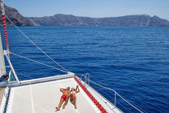 Santorini Cruise on Catamaran with BBQ & Open Bar - Leaving Ammoudi or Athinios Port