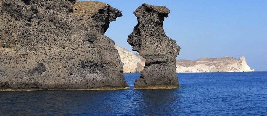 Santorini:Cruises with Catamaran around the Volcanic Island. - Red Beach and its rust-colored volcanic rock
