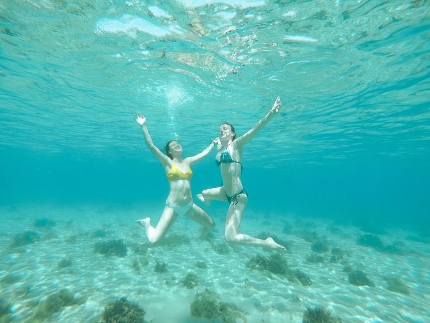 Santorini: Day Cruise with Meal & Open Bar - White Beach, Black Mountain, and the Lighthouse