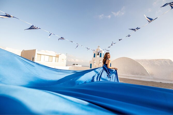 Santorini: Flying Dress Professional Photography <em>Dress Included</em> – Key Points Before You Book’ /></p>
<ul>
<li><strong>Choose your coverage:</strong> The one-hour option stays in Oia, while the three-hour option can include up to three villages and six to 12 photo spots.</li>
<li><strong>Pick your dress by email:</strong> Solo and couple bookings include one dress total. The Best Friends option provides one dress per woman.</li>
<li><strong>Expect active posing:</strong> There is plenty of walking, climbing, and standing in the Santorini sun.</li>
<li><strong>Your photographer leads the session:</strong> You receive help with poses, angles, and dress movement rather than having to invent every shot yourself.</li>
<li><strong>Edited photos arrive later:</strong> Depending on your selected option, expect 35 to 70 professionally edited images in seven to 10 days.</li>
<li><strong>Three-hour bookings include transport:</strong> Hotel, airport, port, and cruise pickup arrangements are available only with the three-hour options.</li>
</ul>
<h2 id="what-this-santorini-photo-shoot-is-really-like">What This Santorini Photo Shoot Is Really Like</h2>
<p><img width="669" height="446" decoding="async" src=