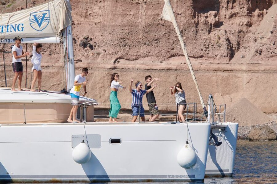 Santorini Gold Catamaran Cruise with Snorkel, BBQ & Open Bar - Red Beach and the red volcanic cliffs