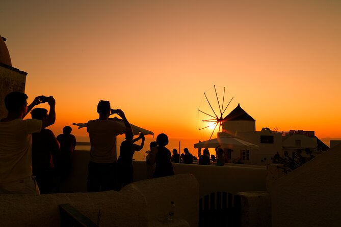 Santorini In One Day Bus Tour with Oia Sunset & optional Sailing - What the guide and vehicle experience may be like