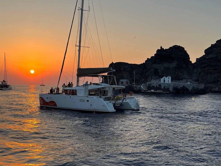 Santorini: Luxury Caldera Cruise with Full Greek Meal - Red Beach for swimming and snorkeling