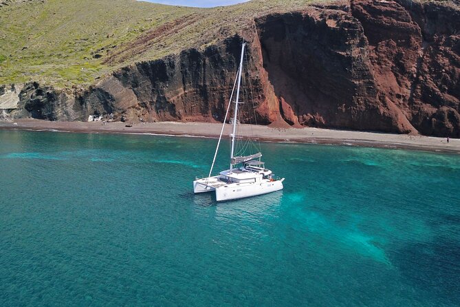 Santorini: Luxury Catamaran Cruise with Fresh Fish BBQ & Drinks - Volcanic rocks and the Sulfur Springs