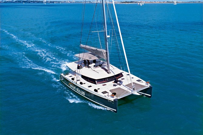 Santorini Luxury Catamaran Day Cruise with BBQ,drinks,transfer - Sailing past the Volcano and Palea Kameni