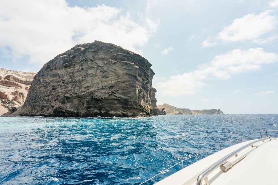 Santorini: Luxury Catamaran Day Trip with Meal and Open Bar - Open bar, music, and the social mood