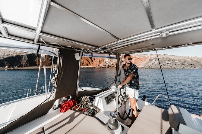 Santorini Luxury Catamaran Private Cruise - The lighthouse, Black Mountain, and Indian Rock