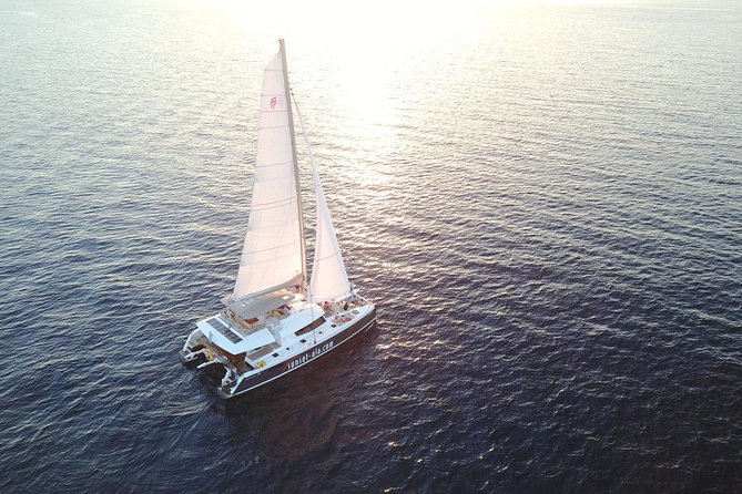 Santorini Luxury Catamaran Sunset Cruise with BBQ, Drink and Transfer - Setting sail from Ammoudi or Athinios