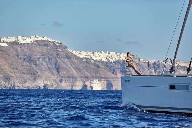 Santorini Luxury Sailing Catamaran Cruise with BBQ, Drinks and Transfer - What the crew adds to the day