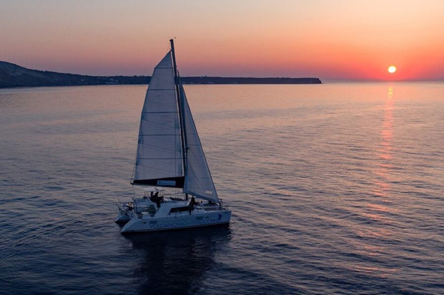 Santorini: Luxury Sunset Cruise with Dinner & Open Bar - Sailing toward Thirassia and the caldera cliffs
