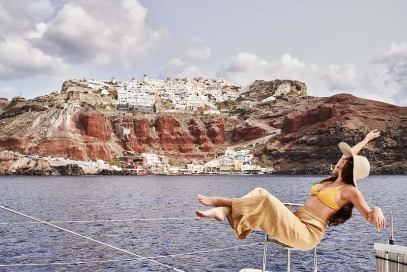 Santorini: Majestic Catamaran Cruise with Meal and Drinks - Pickup, meeting points, and what to carry