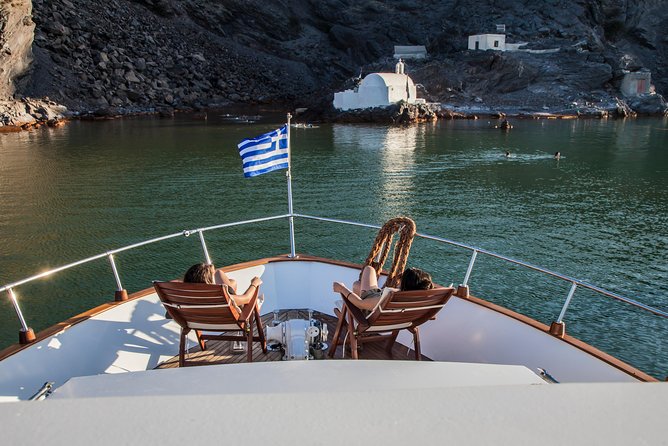 Santorini: Motor Yacht Private Cruise with 5-Course Meal - Leaving Vlihada for Santorini’s volcanic coast