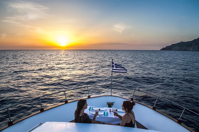 Santorini: Motor Yacht Sunset Cruise with 5-Course Dinner - Leaving Vlihada and meeting Santorini from the sea