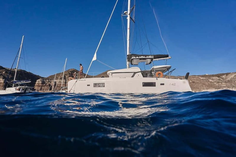 Santorini Oia: Caldera Day Cruise with Snacks & Drinks - Setting out from Ammoudi Bay below Oia
