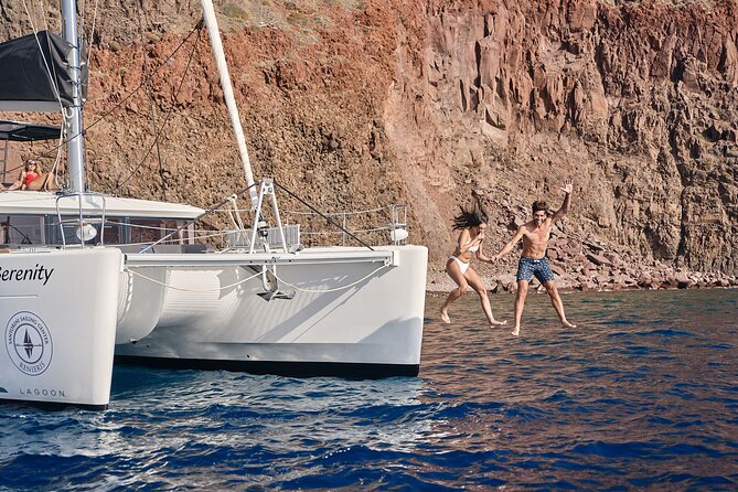 Santorini Oia: Luxury Sunset Cruise with Fresh Fish BBQ & Drinks - The lighthouse and southern coast