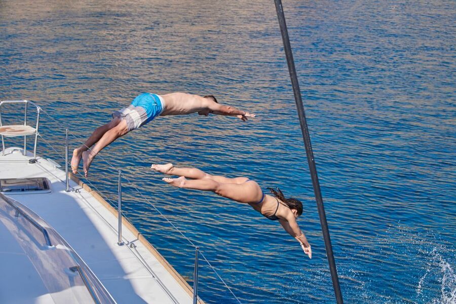Santorini: Platinum Catamaran Cruise w/ BBQ Meal & Open Bar - Swimming at the Palea Kameni hot springs