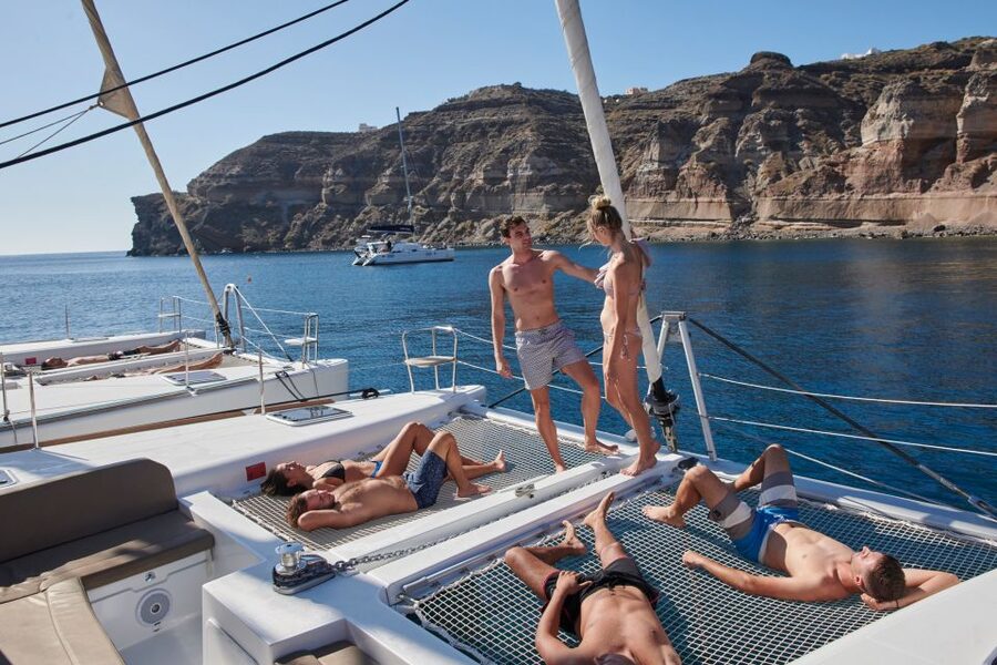 Santorini: Platinum Catamaran Cruise w/ BBQ Meal & Open Bar - The Akrotiri Lighthouse sunset