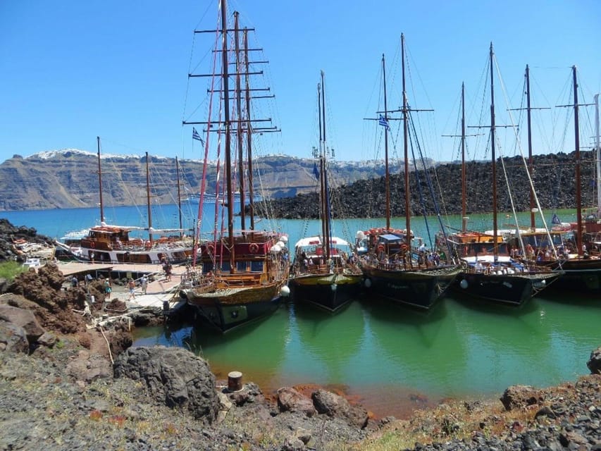 Santorini Port: Cruise to Volcano, Hot Springs & Thirassia - The return sail past Oia and Fira