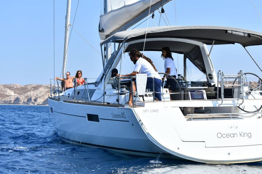Santorini: Private Caldera Sailing Trip with Open Bar & Meal - Entering the caldera below the Venetian lighthouse