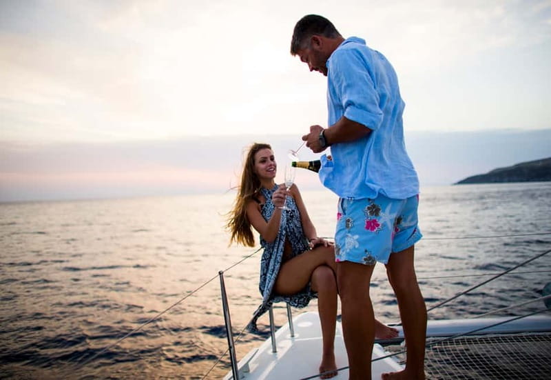 Santorini: Private Catamaran Cruise with BBQ Meal and Drinks - White Beach, Mesa Pigadia, and Red Beach
