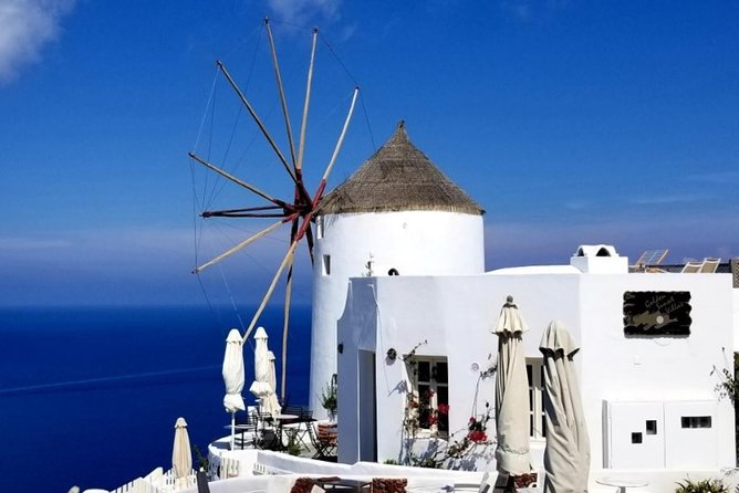Santorini Private Driver: Explore Santorini - Port & Hotel Pickup - Fira’s Three Bells and the island from above