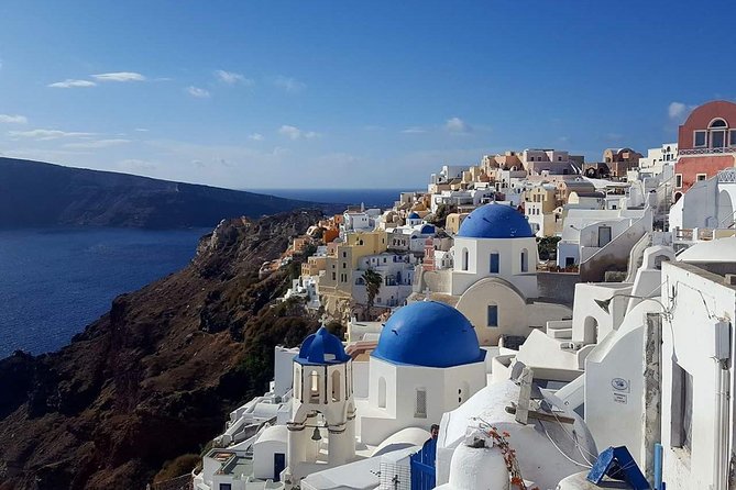 Santorini Private Romantic Tour with Dinner & Wine Tasting - Megalochori sunset with a bottle of local wine
