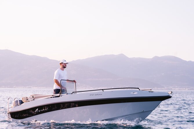 Santorini Rent a Boat - License free private cruise - The volcano and Santorini’s dramatic coastal views