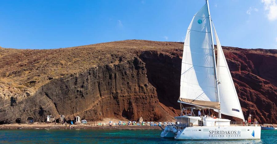 Santorini: Sailing Catamaran Cruise with BBQ and Drinks - Red Beach and White Beach from the water