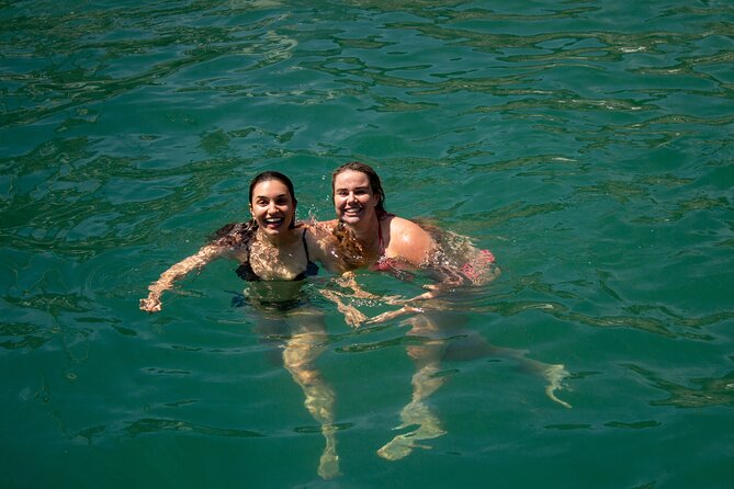 Santorini Sailing Catamaran Daily Cruises w/ Greek BBQ @Thirasia - The volcano coast and a short hot-springs swim