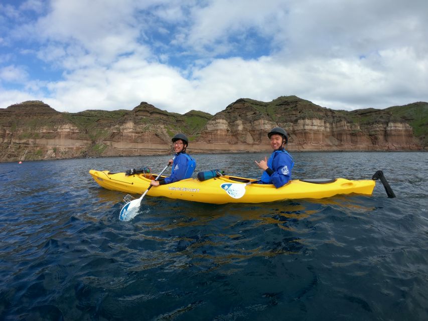 Santorini: Sea Caves Kayak Trip with Snorkeling and Picnic - Inside the blue-lit sea caves