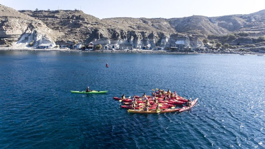 Santorini: Sea Kayaking with Light Lunch - Black Mountain, cliff homes, and the sea cave