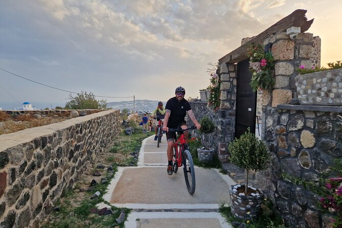 Santorini Small Group Guided E-bike Tour & Local Tomato Museum - Riding through Santorini’s low basket vineyards