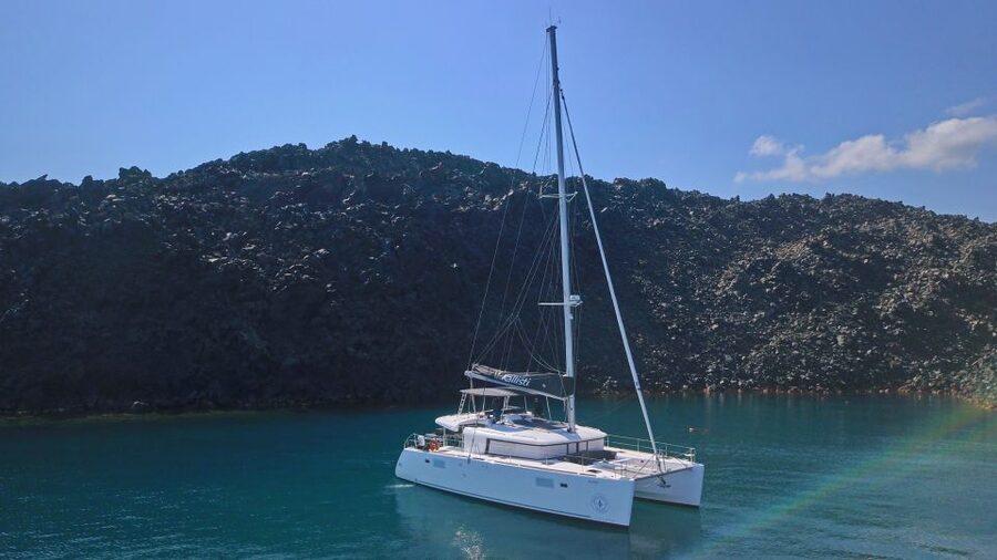 Santorini: Southern Island Luxury Catamaran Cruise with Meal - Passing the Akrotiri Lighthouse