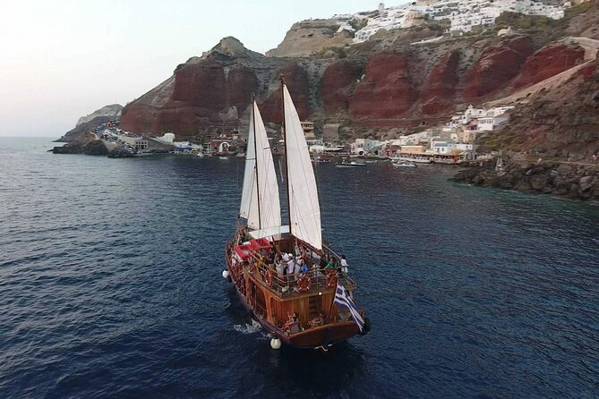 Santorini Sunset Cruise in Caldera - Sailing below the caldera at golden hour