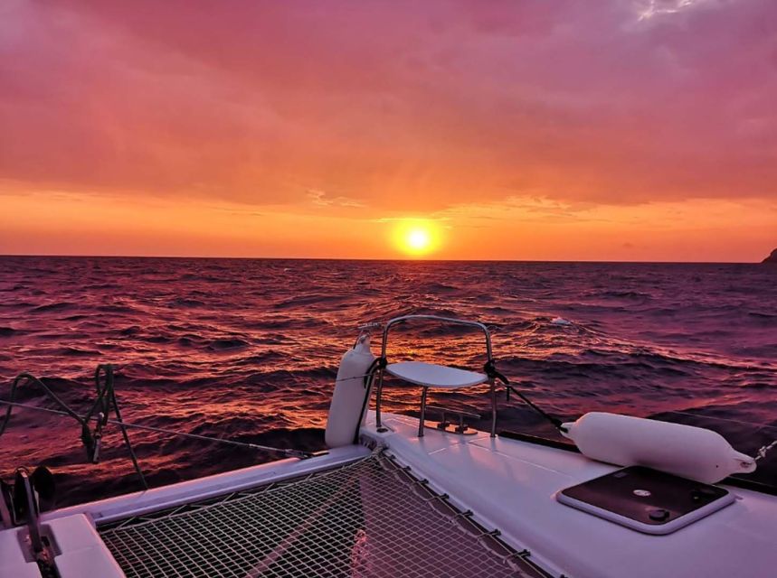Santorini: Sunset Cruise with Greek Dinner and Transfer - The sunset return to the marina