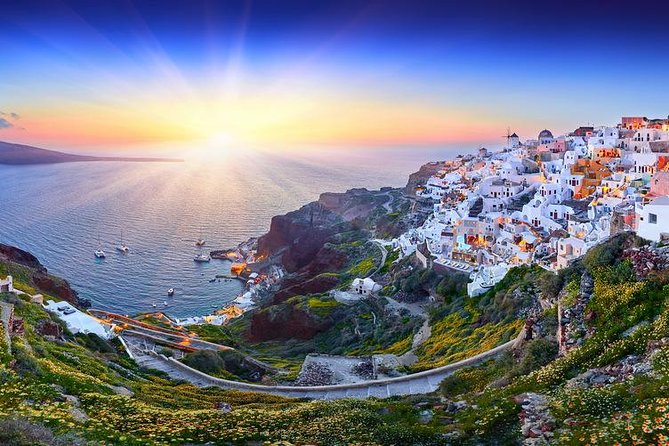 Santorini Sunset Dinner Cruise Including Nea Kameni Visit - Watching the sun drop over Thirasia