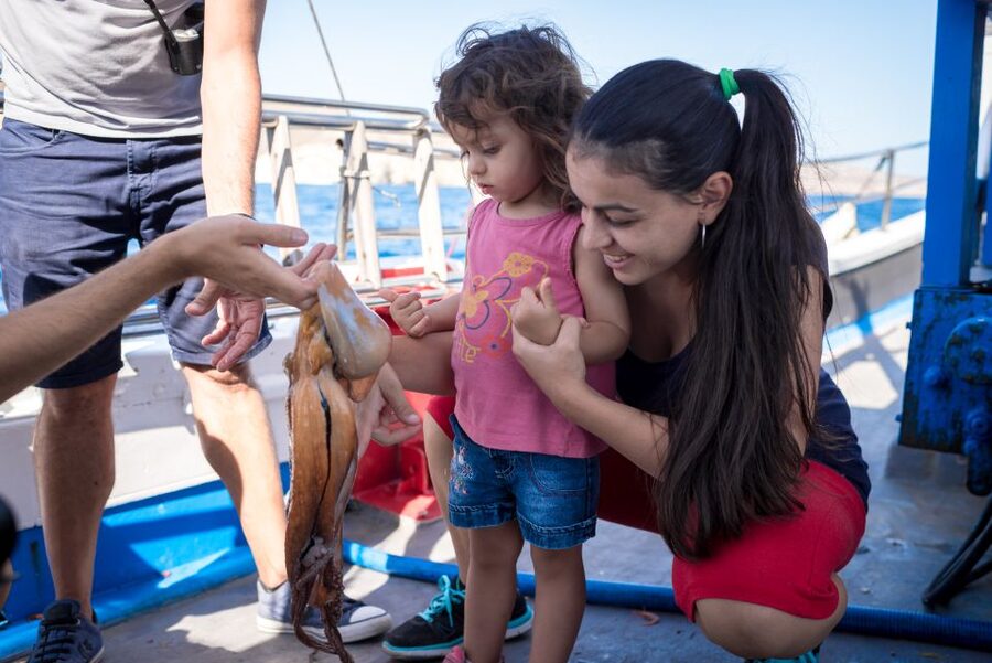 Santorini Sunset Fishing Trip with Dinner and Drinks - Traditional music and a sunset at sea