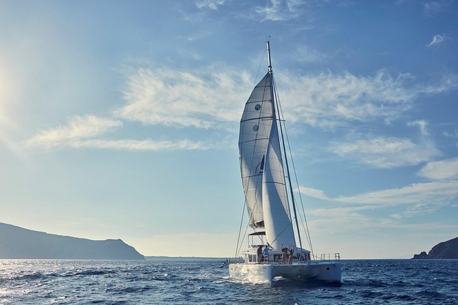 Santorini Sunset Luxury Sailing Catamaran Cruise with BBQ, drinks, transfer - Caldera views, Palea Kameni, and the volcano