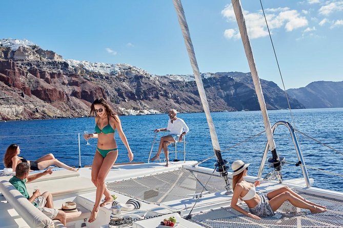 Santorini Sunset Luxury Sailing Catamaran Cruise with BBQ, drinks, transfer - Red Beach: a dramatic first swim
