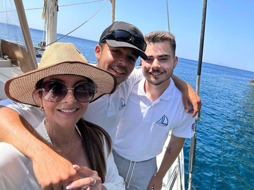 Santorini: Sunset Sailing Cruise, with Dinner and Drinks - Red Beach, White Beach, and the Akrotiri coast