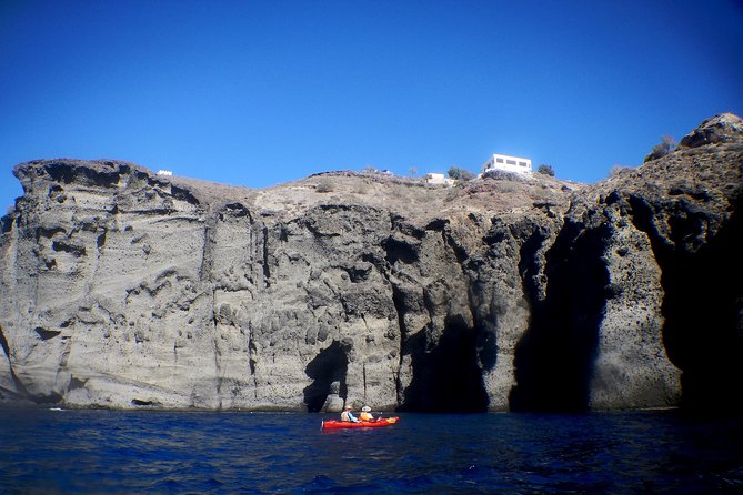 Santorini: Sunset Sea Kayak with Light Dinner with Pick-up Option - Sunset from a double kayak