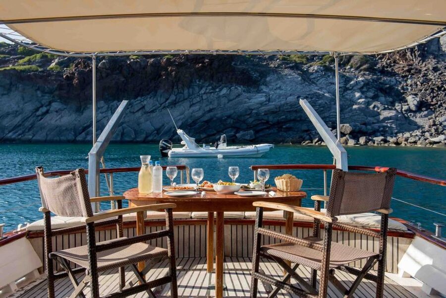 Santorini: Traditional Wooden Boat Tour with Meal and Wine - Thirassia Island, snorkeling, and a quieter side of Santorini